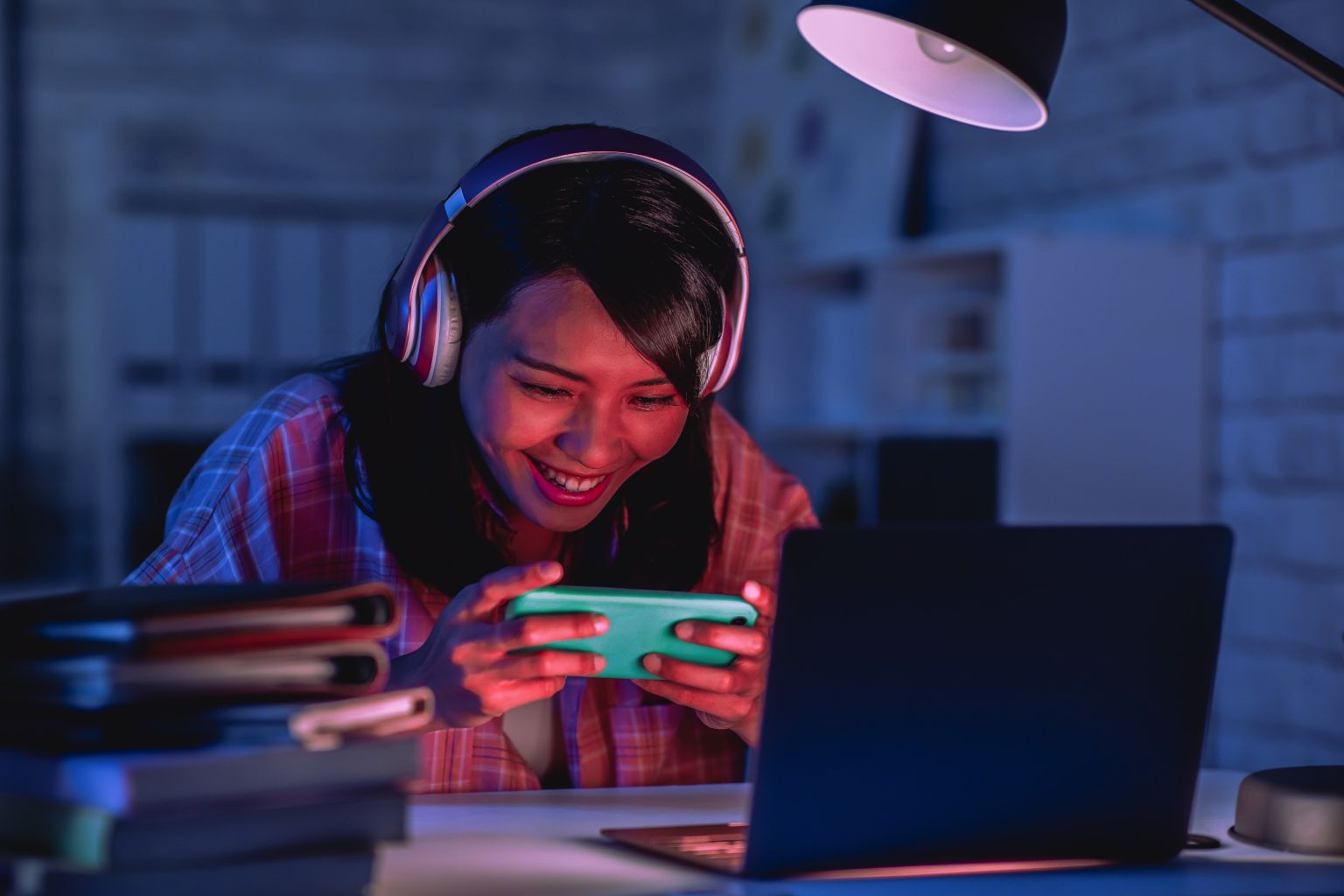 Lady-with-Phone-and-Headphones-on.